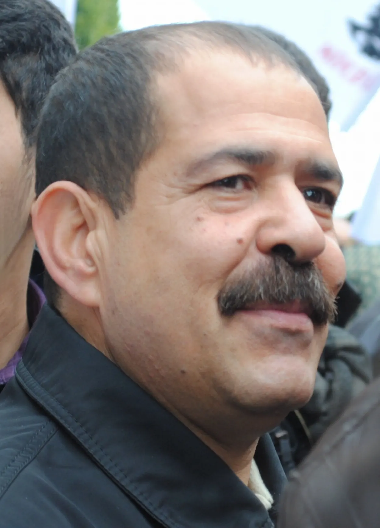 شكري بلعيد، المحامي ووجه المعارضة التونسية الذي اغتيل في 6 فيفري 2013، خلال تجمع في تونس العاصمة يوم 14 جانفي 2012